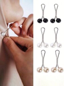 gently securing a fabric with a pearlescent white magnetic hijab pin (left) and a display of six pairs of magnetic scarf clasps in black, white, and champagne pearl finishes (right).