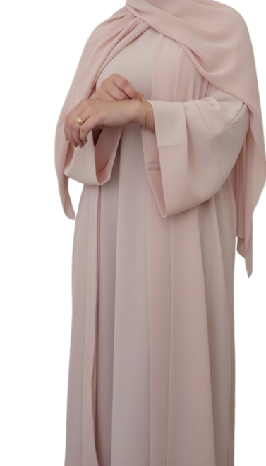 close-up of a model wearing a black abaya with wide, bell-shaped sleeves featuring elaborate pink floral and gold vine embroidery. The cuff has a scalloped, embroidered edge.